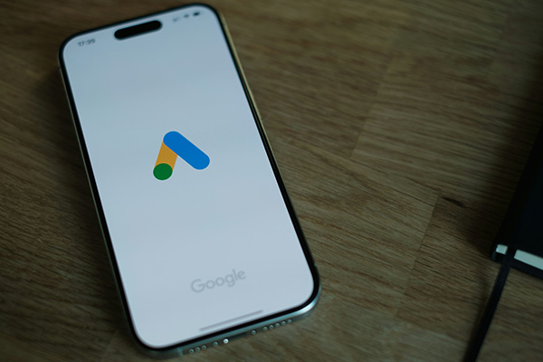 Person analyzing Google Ads performance dashboard